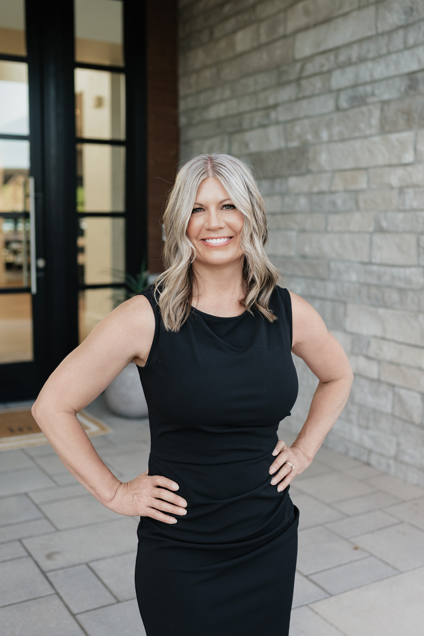 Tracie McDonald smiling, hands on hips