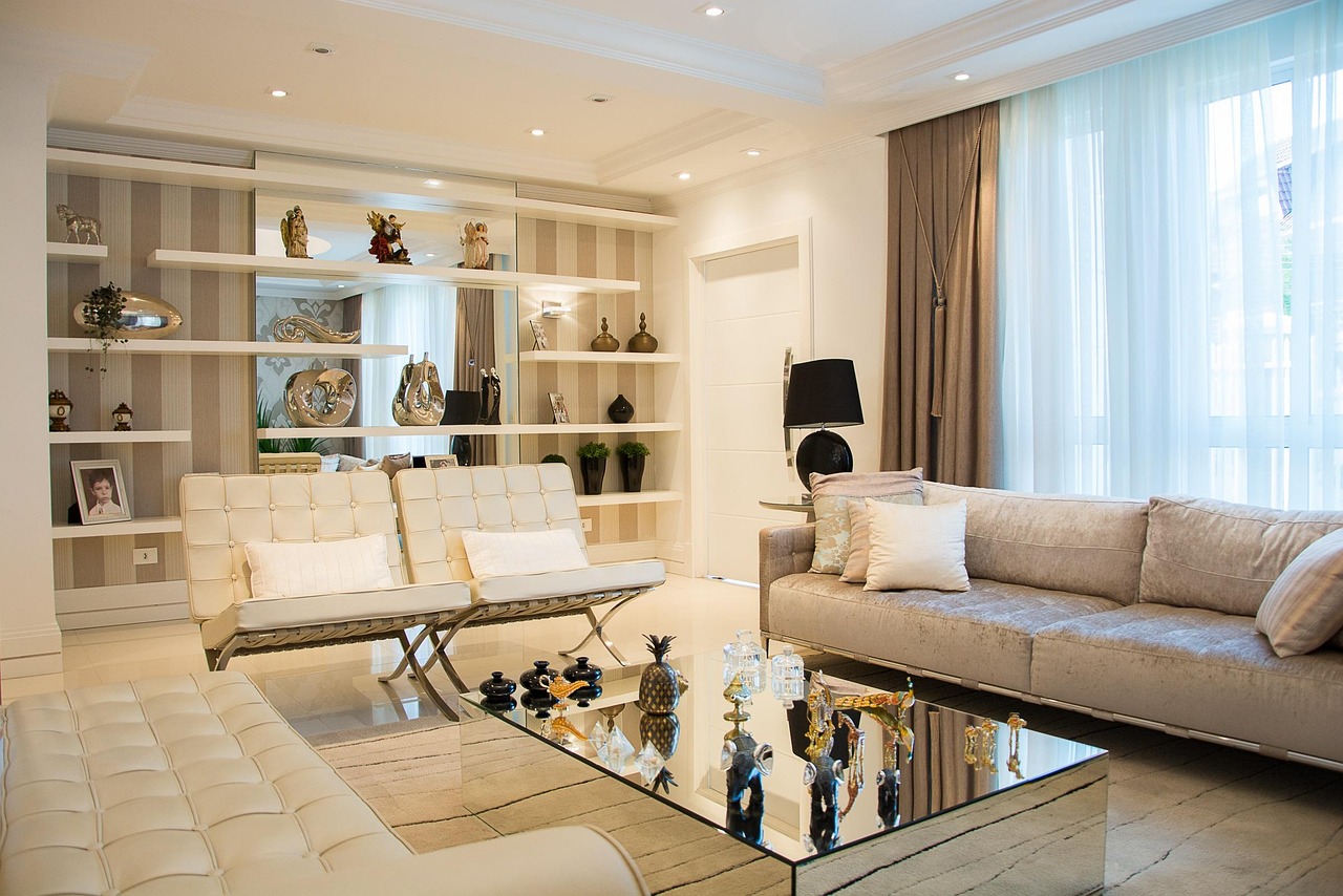 Soft cream living room with built-in shelves and sheer curtains