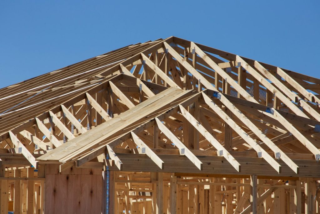 New construction home under construction with wood framing